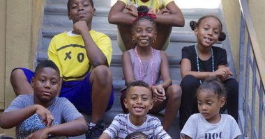 young students sitting on steps