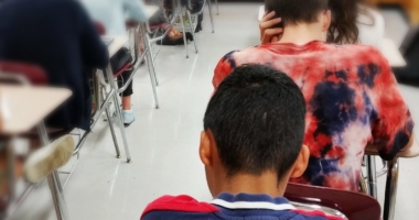 Students sitting at desks in a classroom